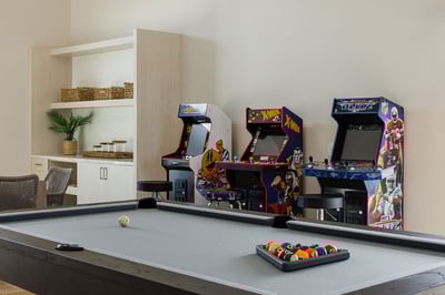 Your own game room equipped with a pool table & arcade games for some friendly competition. You'll a