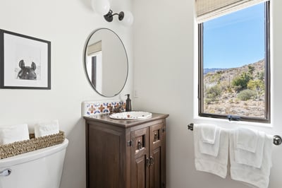 En suite bathroom with sink and vanity.
