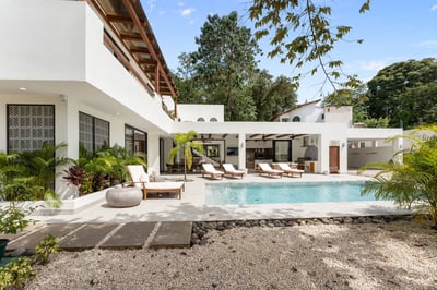 - Bask in the sun by a crystal clear pool surrounded by greenery and modern design
- Multiple lounge