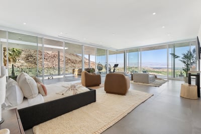 The impressive primary suite has a King bed, Peloton spin bike, writing desk, two closets, steam sho