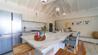 Kitchen & Dining Area: Fully equipped kitchen with electric oven, cooker with two gas and two glass-