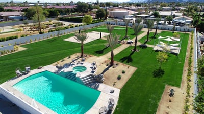 Expansive 1.0 acre yard with resort-style amenities: large pool/spa, sand volleyball, putting green,