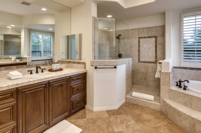Primary en suite bath with two vanities, shower and jetted tub