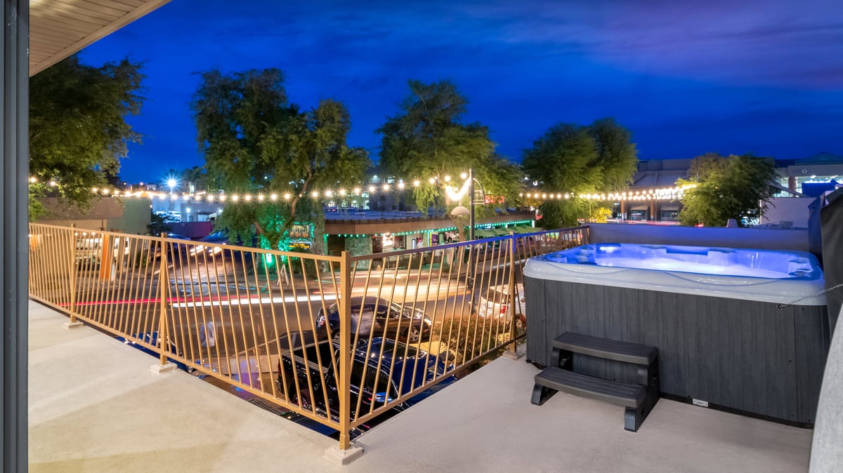 Image of Large Patio Featuring Hot Tub Overlooking Street. - Image 31