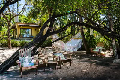 Feet in the sand, drink in hand, hammock swaying. Life's good here!