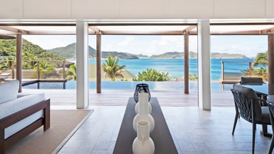 Living Area: Great room, ocean-view lounge, ceiling fans. In a separate room, HD-TV, DVD player