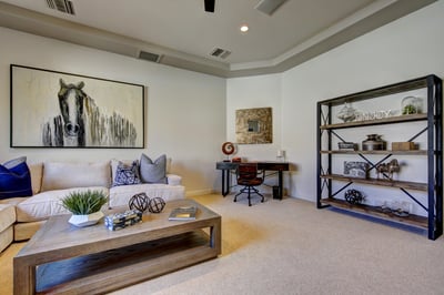 Media room with writing desk, large sectional sofa and HDTV