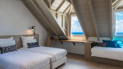 Bedroom 3: Located on the first floor with ocean views. Twin beds (can be prepared with a king size 