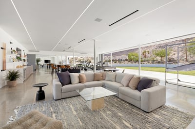 Entertainment room featuring a full bar (alcohol not included in rental) and pullout sofa.