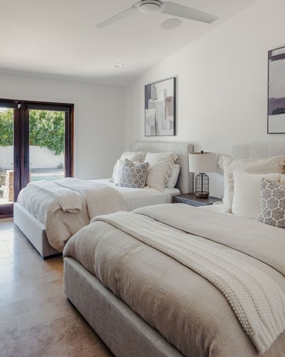 Guest bedroom 2 with 2 Queen beds, smart TV, direct patio access and en suite bathroom with double v