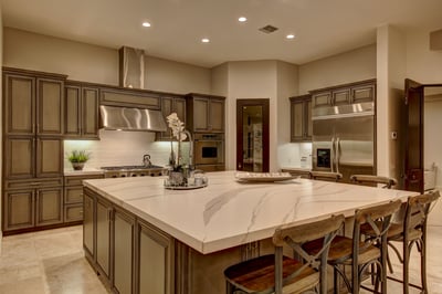 Chef's kitchen with stainless steel appliances, custom center island and bar seating for 6.