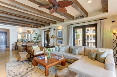 Large French doors opening out to the terrace from the living area make the room feel all the more s