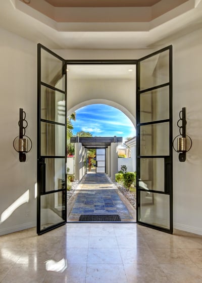 Grand entry with custom 10-ft glass doors