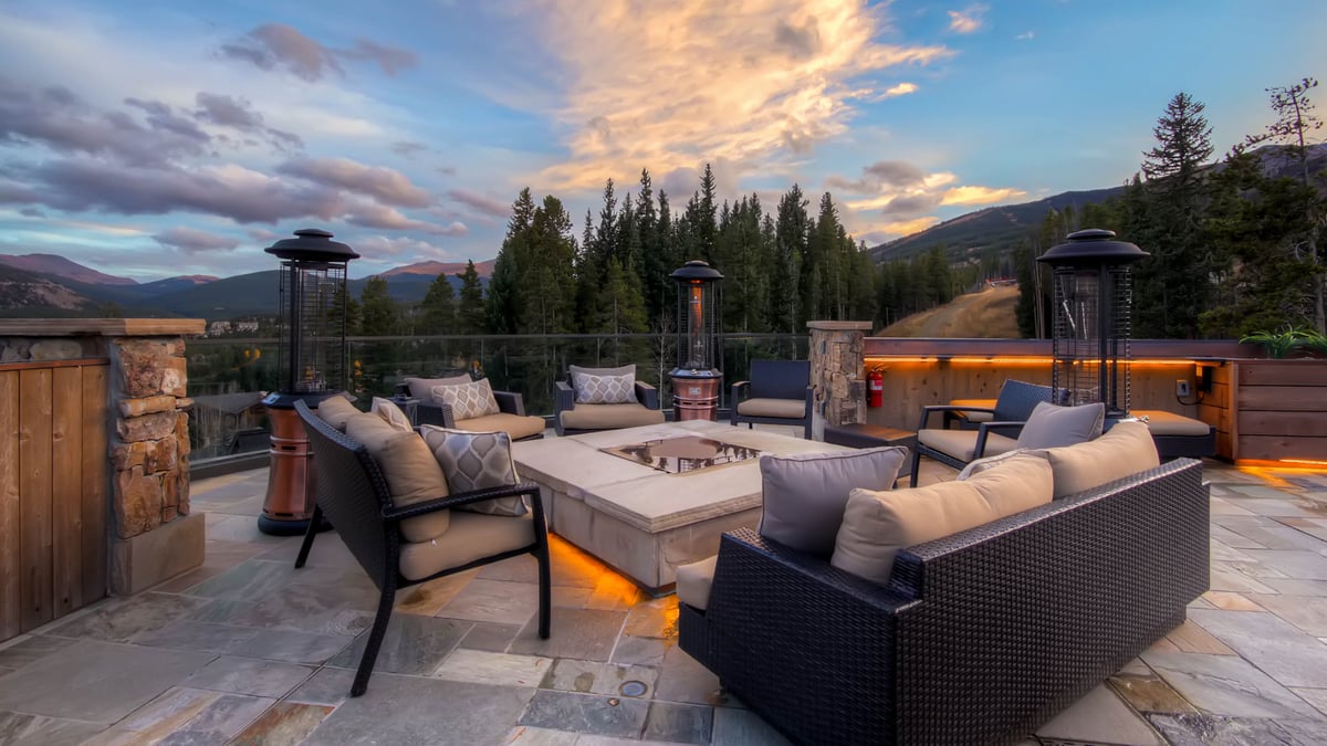 Summer sunset on rooftop patio with gas fire pit - Image 10