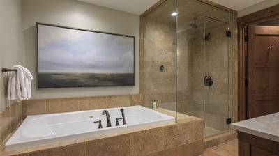 Primary ensuite with soaking tub and separate shower
