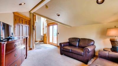 Primary suite sitting area with sleeper sofa