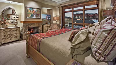 Primary suite with fireplace and TV
