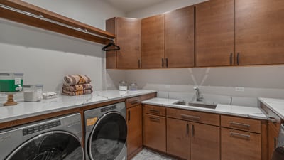 Laundry room with 2 washers and 2 dryers on main level