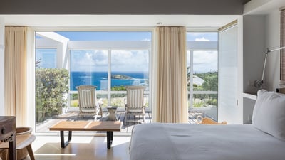 Bedroom 1: Located in a separate building next to the main house. King bed, air conditioni