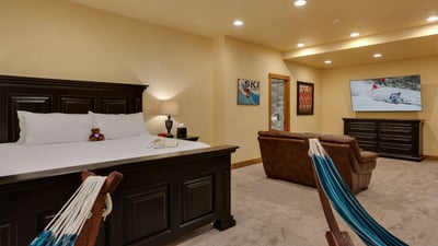 King suite on lower level with sitting area and TV