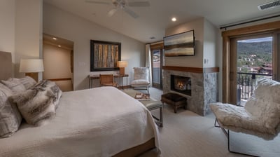 Primary suite with fireplace, TV, desk