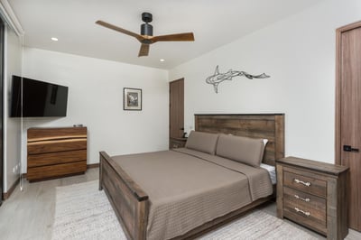 - Unwind in a cozy bedroom featuring a rustic wood bed and matching nightstands
- Enjoy your favorit