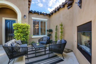 Front courtyard with lounge seating and fire place