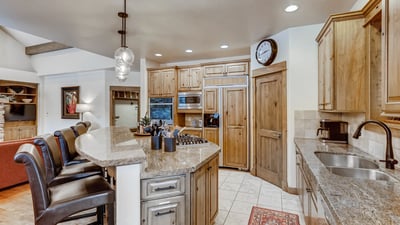 Gourmet kitchen with double ovens, gas cooktop