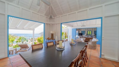 Kitchen & Dining Area: Open-air with superb views over Gustavia harbor, St Martin and the ocean. Don