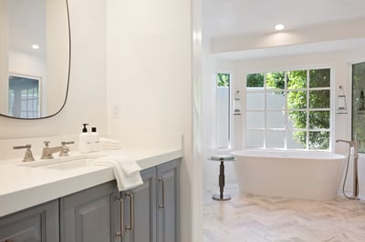 Luxurious ensuite bathroom with huge walk-in shower and a freestanding tub.