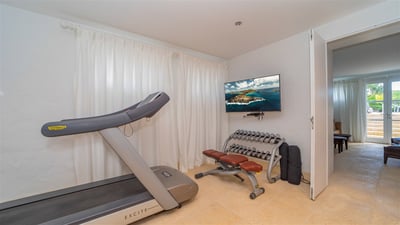Fitness Room: Located behind the TV room. Air conditioning, well-equipped exercise room wi