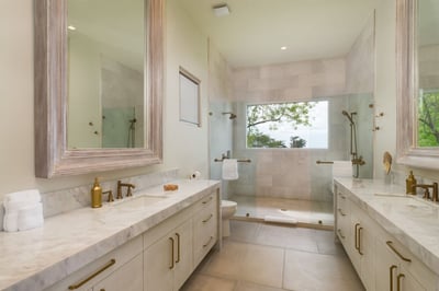 - Start your day fresh with a dual vanity setup and large sunlit mirrors
- Spacious walk in shower w