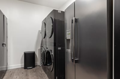 Two full-sized washer and dryers