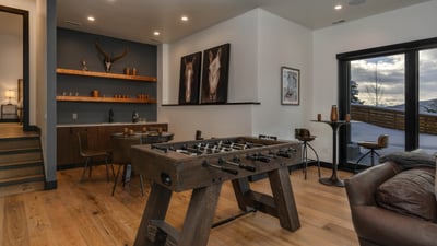 Foosball, game table and wet bar makes this a favorite spot