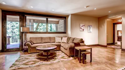 Lower level family room with TV and queen sleeper sofa