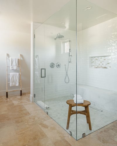 Luxurious en suite bathroom with walk-in shower and a freestanding tub.