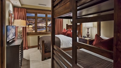 Family suite 2 with queen bed and queen over queen bunk