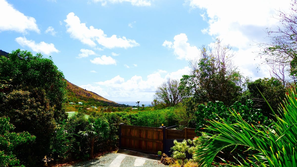 Outdoors: Beautiful garden surrounding the property. Private parking at the entrance.  - Image 5