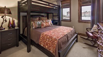 Bunkroom with a twin over queen bunk