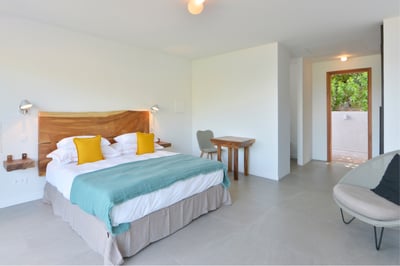 Bedroom 2: Located on the ground floor in front of a garden with ocean views. Private terrace. A kin