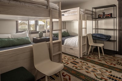 Sleep comfortably in your modern bunk bed with built-in storage and enjoy mountain views from your w