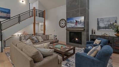 Enjoy family time in the great room on the main level with TV and fireplace