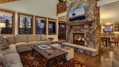 Open great room with cozy couches and fireplace