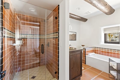 En suite bathroom with walk-in shower and separate tub!