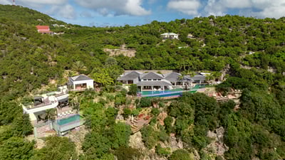 Outdoors: Located In the prestigious Gouverneur heights with breathtaking views of Gouverneur bay an