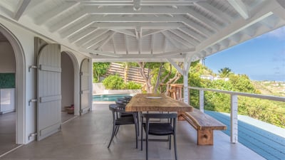 Dining Areas: Outdoor dining table on the covered terrace facing the views. Another dining table on 