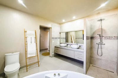 #1. His and Hers Double Sink Bathroom, Each with Its Own Side, and a Spacious, Modern Shower