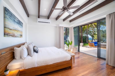 #1. Downstairs, you'll score the first Primary Suite complete with a pool and an ocean view.