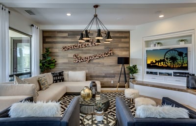Living room that is great for entertaining with feature accent wall featuring Coachella & Stagecoach