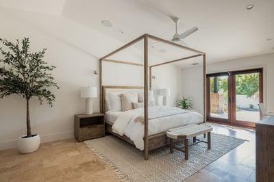 The primary suite, located off the left wing has a king-sized bed and writing desk. This room also h